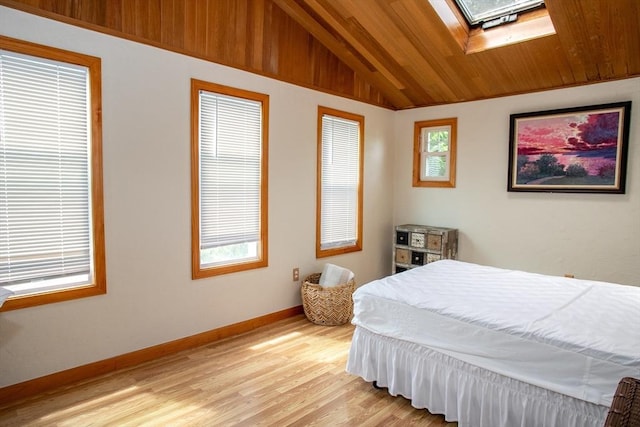 22 Everton Ave, Worcester, MA 01604 - bedroom featuring a skylight, lofted ceiling, light wood-style flooring, baseboards, and wooden ceiling