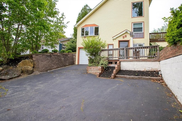 22 Everton Ave, Worcester, MA 01604 - view of front of property featuring a garage and asphalt driveway