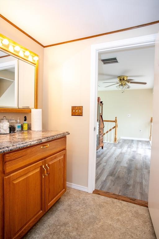 22 Everton Ave, Worcester, MA 01604 - bathroom featuring vanity, ceiling fan, and baseboards
