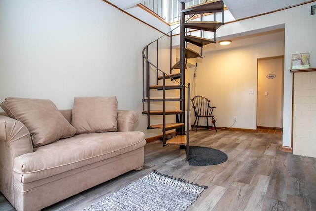 22 Everton Ave, Worcester, MA 01604 - living room with stairs, wood finished floors, and baseboards