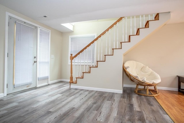 22 Everton Ave, Worcester, MA 01604 - entrance foyer featuring stairway, wood finished floors, and baseboards