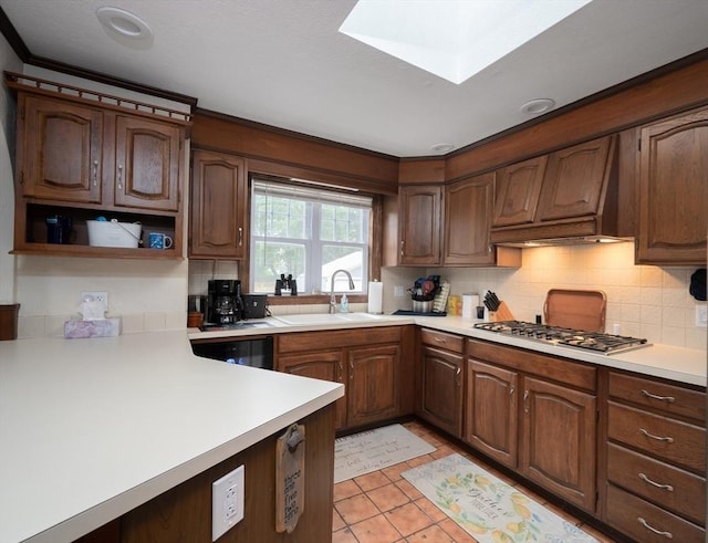 203 Pond St, Weymouth, MA 02190 - kitchen with a sink, stainless steel gas stovetop, light countertops, and decorative backsplash