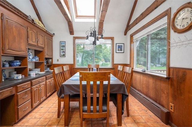 203 Pond St, Weymouth, MA 02190 - dining area with baseboard heating, a wainscoted wall, a chandelier, wood walls, and light tile patterned flooring