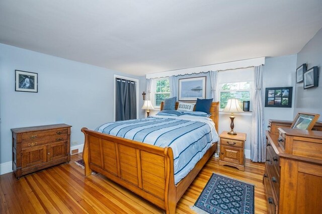 203 Pond St, Weymouth, MA 02190 - bedroom featuring light wood-style flooring and baseboards