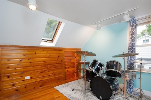 203 Pond St, Weymouth, MA 02190 - miscellaneous room with rail lighting, a skylight, wood finished floors, and lofted ceiling
