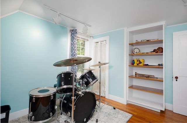 203 Pond St, Weymouth, MA 02190 - game room featuring track lighting, wood finished floors, ornamental molding, and baseboards