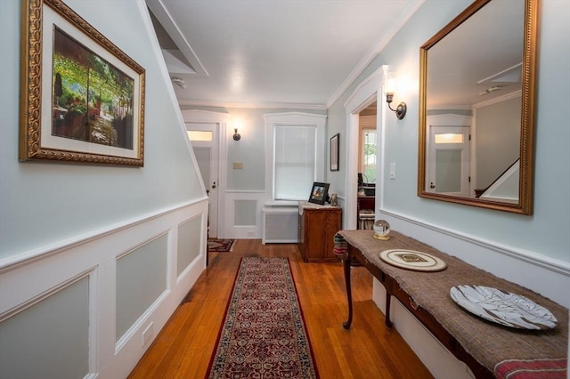 203 Pond St, Weymouth, MA 02190 - hall featuring ornamental molding, wood finished floors, wainscoting, and a decorative wall