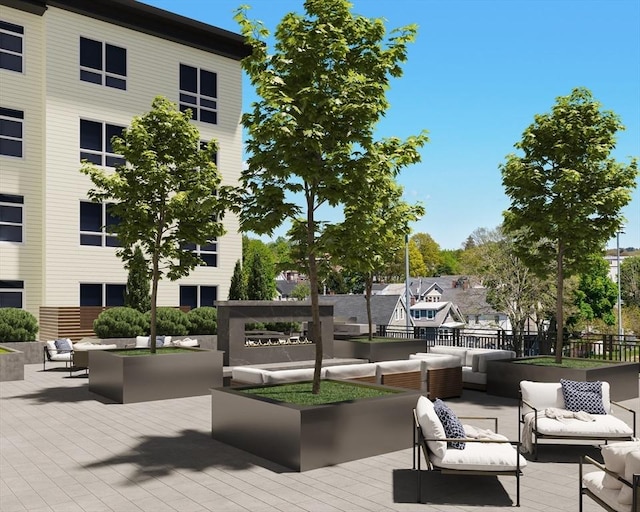 view of property's community with outdoor lounge area and a wooden deck