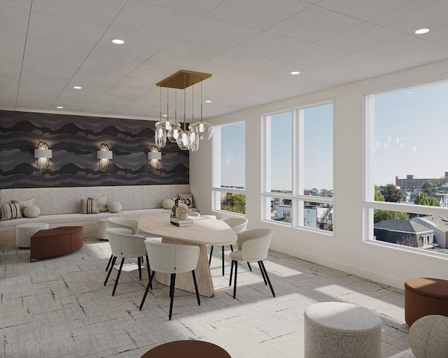 dining area with plenty of natural light, recessed lighting, baseboards, light carpet, and wallpapered walls