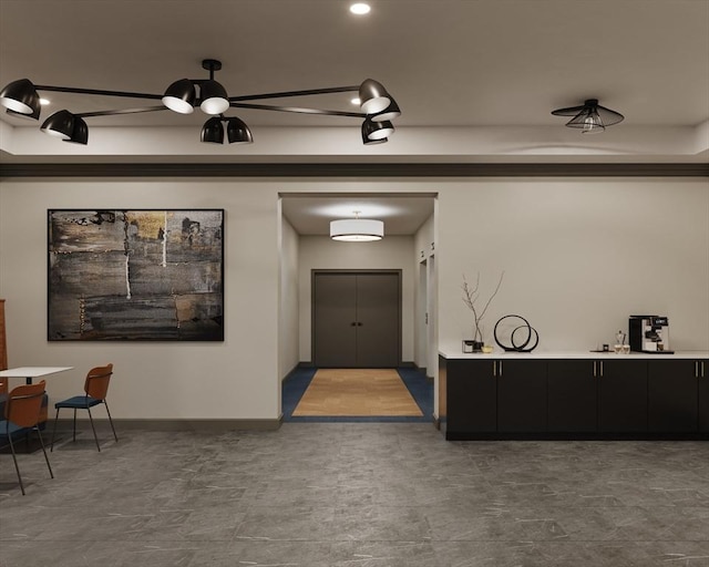 interior space featuring baseboards