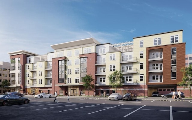 view of building exterior with uncovered parking