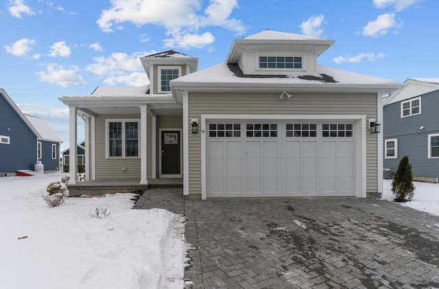 view of front of house featuring a garage and a porch