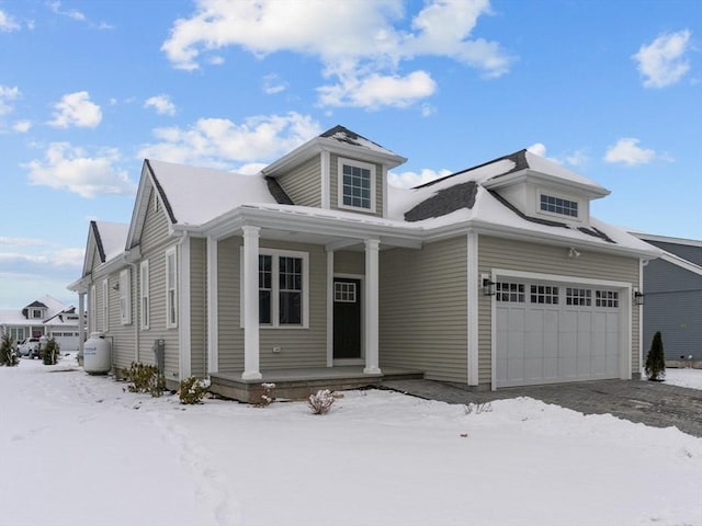 view of front facade with a garage and covered porch