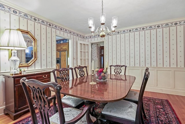 84 Englewood Rd, Longmeadow, MA 01106 - dining space with a chandelier, light wood-type flooring, crown molding, wallpapered walls, and wainscoting