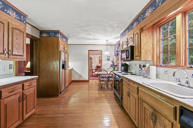 84 Englewood Rd, Longmeadow, MA 01106 - kitchen featuring black appliances, a sink, backsplash, light wood-type flooring, and crown molding