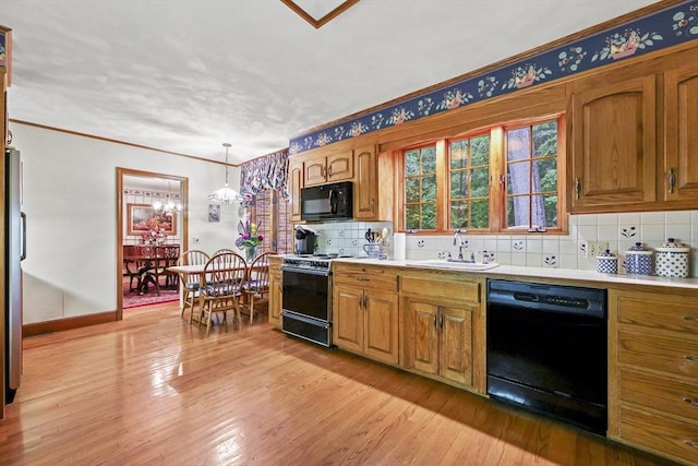 84 Englewood Rd, Longmeadow, MA 01106 - kitchen featuring black appliances, a sink, tasteful backsplash, light wood finished floors, and brown cabinets