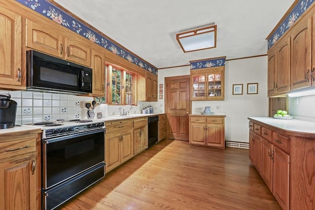 84 Englewood Rd, Longmeadow, MA 01106 - kitchen featuring black appliances, backsplash, light wood finished floors, light countertops, and crown molding