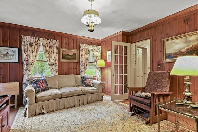 84 Englewood Rd, Longmeadow, MA 01106 - living area with wood walls, crown molding, and wood finished floors