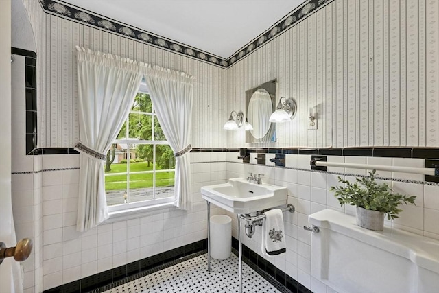 84 Englewood Rd, Longmeadow, MA 01106 - half bath featuring toilet, tile walls, a wainscoted wall, and wallpapered walls
