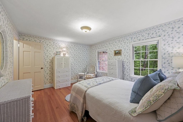 84 Englewood Rd, Longmeadow, MA 01106 - bedroom featuring wallpapered walls, wood finished floors, and baseboards