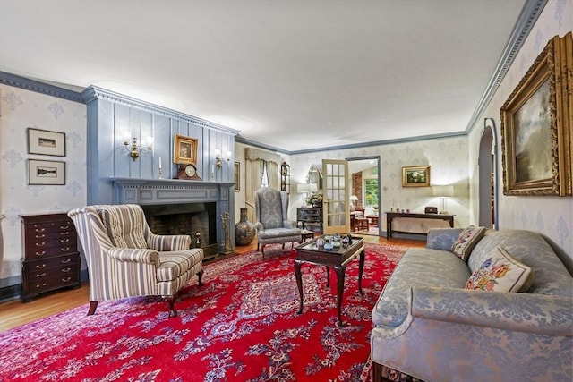 84 Englewood Rd, Longmeadow, MA 01106 - living room with wallpapered walls, wood finished floors, ornamental molding, a fireplace, and arched walkways