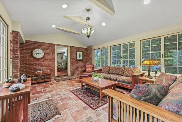 84 Englewood Rd, Longmeadow, MA 01106 - sunroom with lofted ceiling, brick wall, and stone tile floors