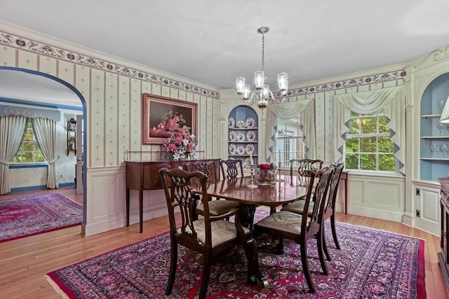 84 Englewood Rd, Longmeadow, MA 01106 - dining room with wallpapered walls, a chandelier, healthy amount of natural light, a wainscoted wall, and wood finished floors