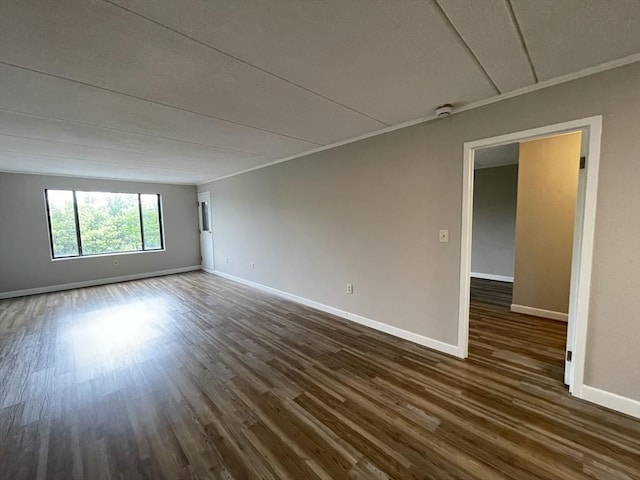 1550 Worcester Rd Unit 524, Framingham, MA 01702 - spare room featuring dark wood finished floors, baseboards, and crown molding