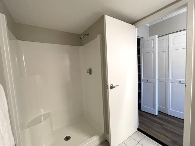 1550 Worcester Rd Unit 524, Framingham, MA 01702 - bathroom featuring a shower and tile patterned floors