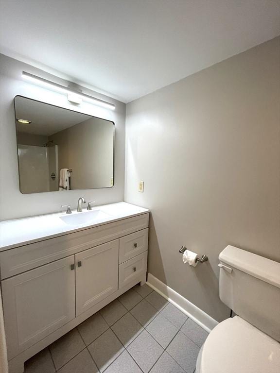 1550 Worcester Rd Unit 524, Framingham, MA 01702 - bathroom with tile patterned flooring, toilet, baseboards, and vanity