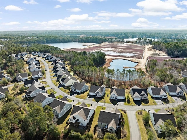 21 Bearberry Path Unit 0, Plymouth, MA 02360 - aerial view of property's location featuring a large body of water, nearby suburban area, and a heavily wooded area
