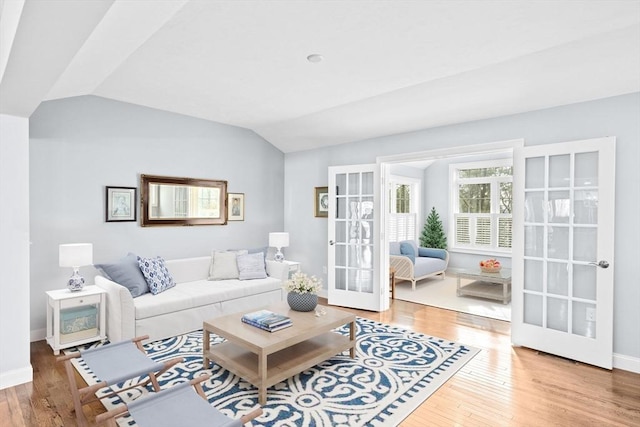 21 Bearberry Path Unit 0, Plymouth, MA 02360 - living area featuring french doors, vaulted ceiling, wood finished floors, and baseboards