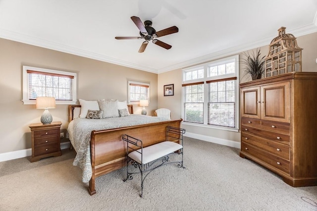 bedroom featuring ornamental molding, light carpet, and ceiling fan