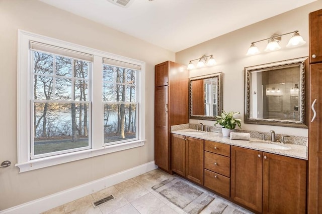 bathroom featuring vanity and tile patterned flooring