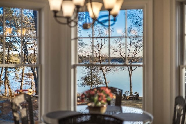 dining space featuring a water view