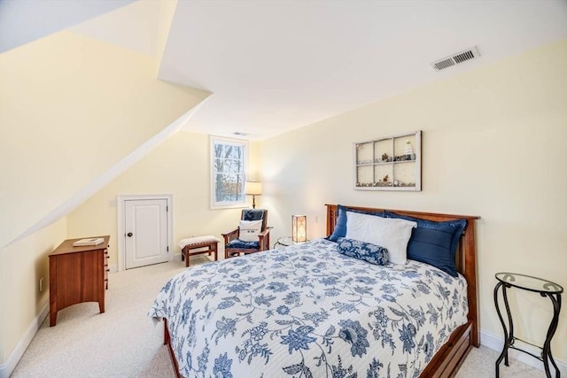 bedroom with light carpet and vaulted ceiling