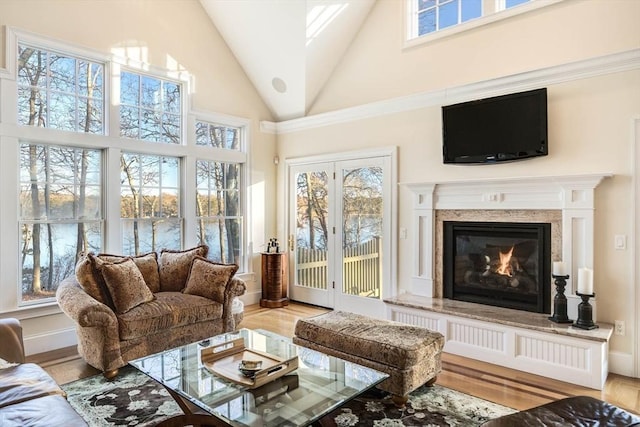 sunroom featuring lofted ceiling and plenty of natural light