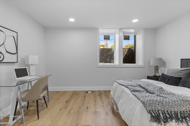 bedroom with light hardwood / wood-style floors