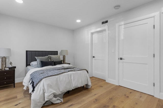 bedroom with light hardwood / wood-style flooring