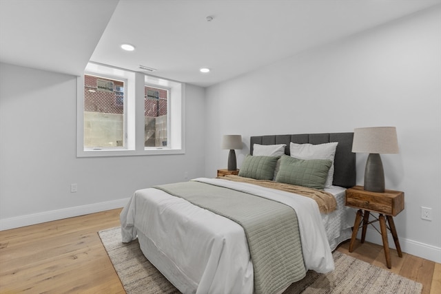 bedroom featuring light hardwood / wood-style floors