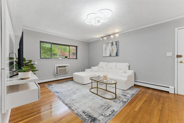 12 Riverside St Unit 1-3, Watertown, MA 02472 - living area featuring a baseboard heating unit, a wall unit AC, ornamental molding, wood finished floors, and rail lighting