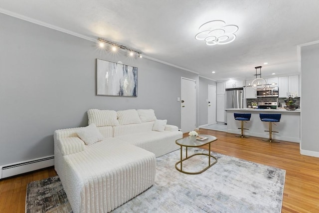 12 Riverside St Unit 1-3, Watertown, MA 02472 - living area featuring ornamental molding, a baseboard radiator, light wood-type flooring, recessed lighting, and baseboards