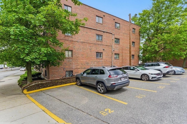12 Riverside St Unit 1-3, Watertown, MA 02472 - view of building exterior with uncovered parking
