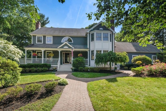 1 Liberty Ln, North Reading, MA 01864 - victorian house with a chimney, a porch, and a front yard