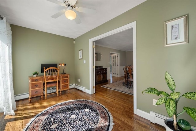 1 Liberty Ln, North Reading, MA 01864 - office area featuring a baseboard heating unit, wood finished floors, and a ceiling fan