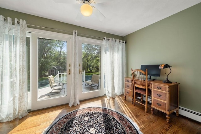 1 Liberty Ln, North Reading, MA 01864 - doorway with wood finished floors, a baseboard radiator, and ceiling fan