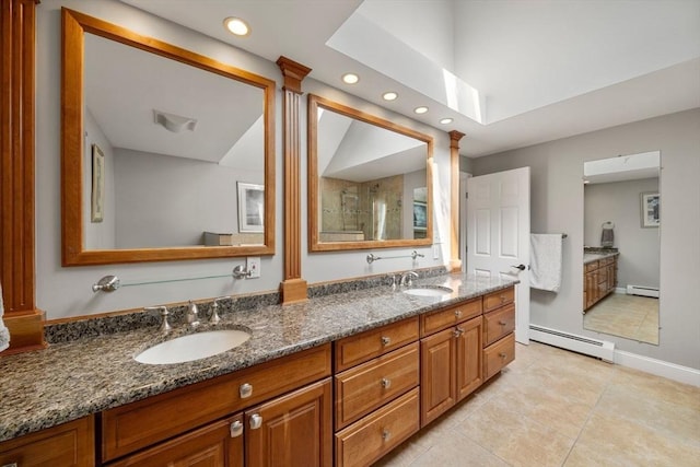 1 Liberty Ln, North Reading, MA 01864 - bathroom featuring a baseboard radiator, double vanity, tile patterned floors, recessed lighting, and ornate columns