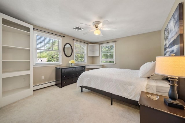 1 Liberty Ln, North Reading, MA 01864 - bedroom featuring a baseboard heating unit, light carpet, and a ceiling fan