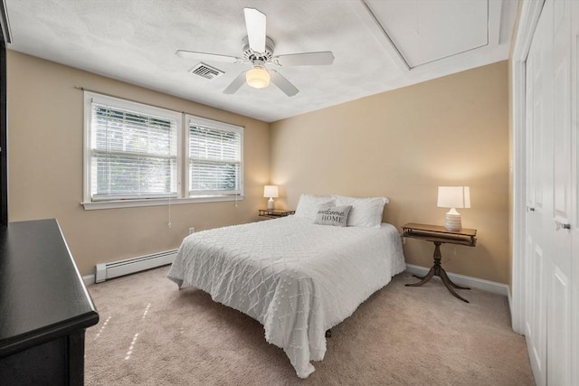 1 Liberty Ln, North Reading, MA 01864 - bedroom with baseboard heating, light carpet, attic access, a closet, and a ceiling fan