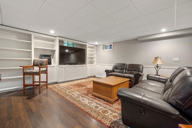 1 Liberty Ln, North Reading, MA 01864 - living room with dark wood finished floors, built in features, recessed lighting, a wainscoted wall, and a drop ceiling